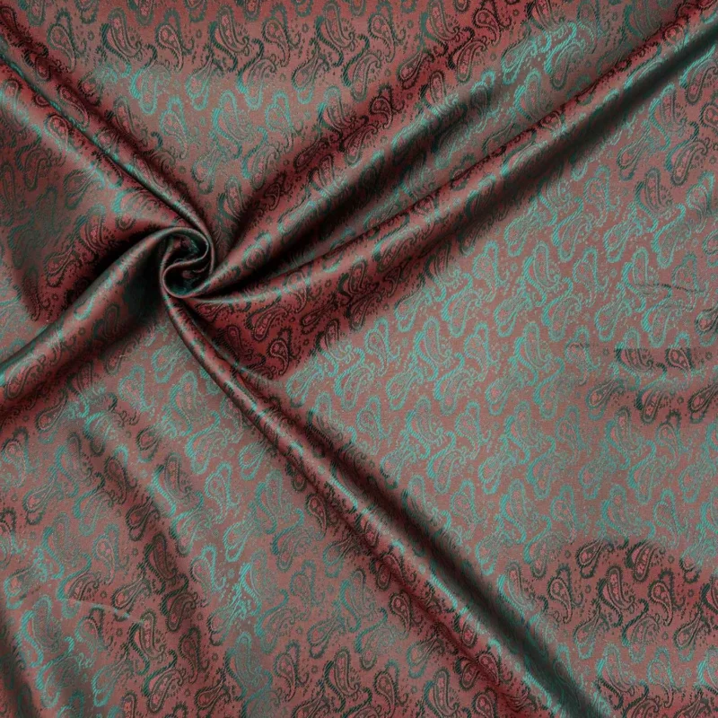 Fodertyg Jacquard - Rött och grönt skimrande Köp nu